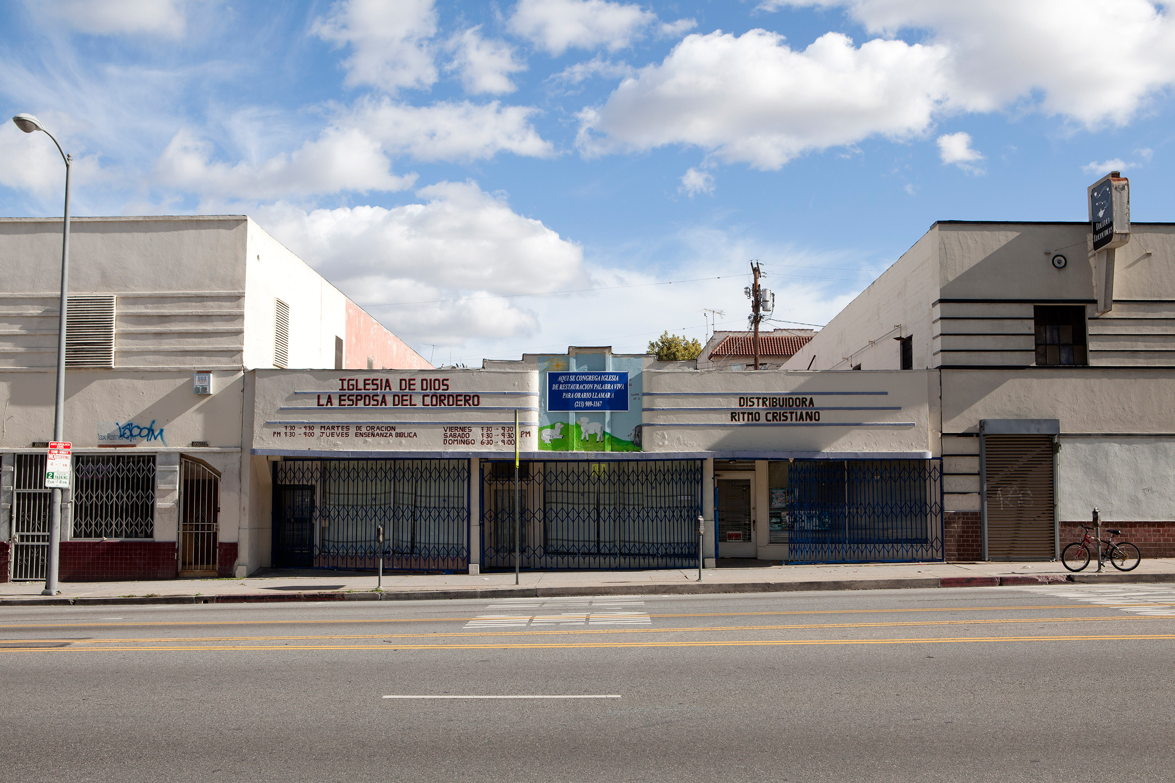 Click to Enlarge Oil company behind a church on Alvarado