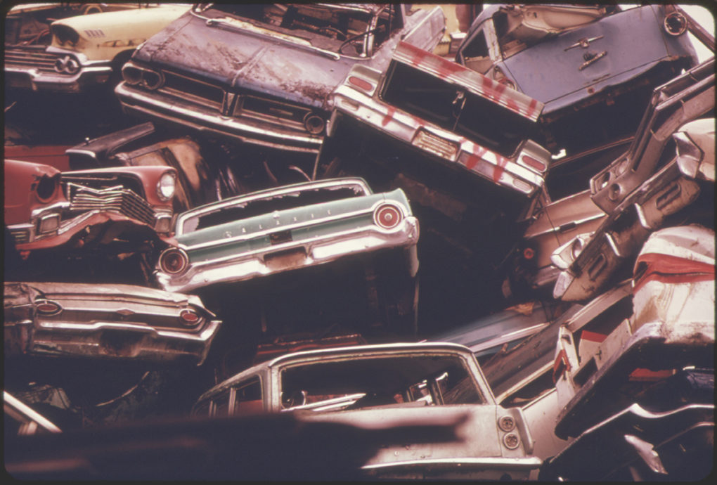 American automobiles ready to be crushed and shipped to Japan, where recycled materials were used to make Toyotas and Datsuns