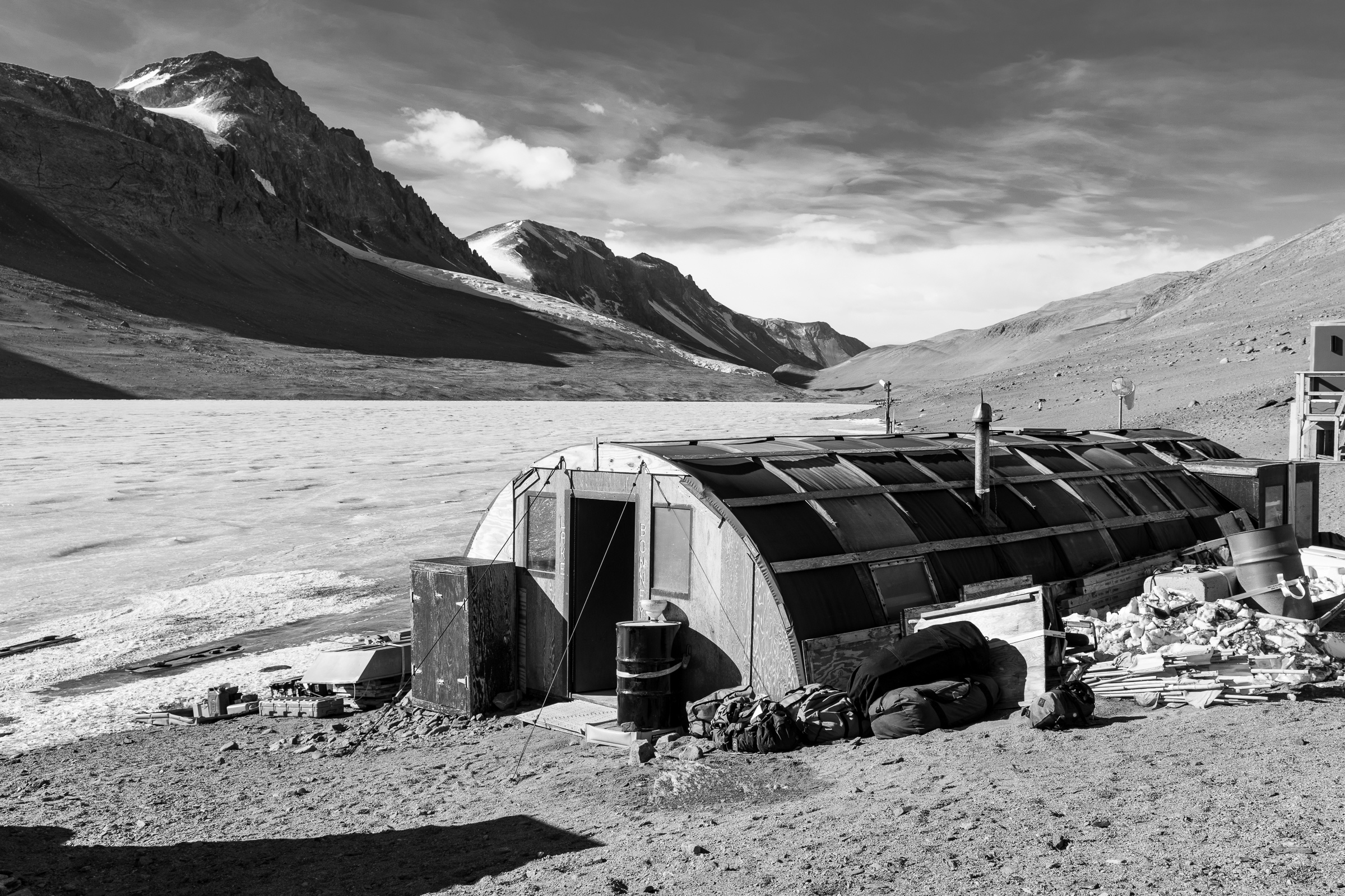 Click to Enlarge Lake Bonney science camp at Taylor Valley, west of McMurdo Station, with a repurposed Korean War structure.