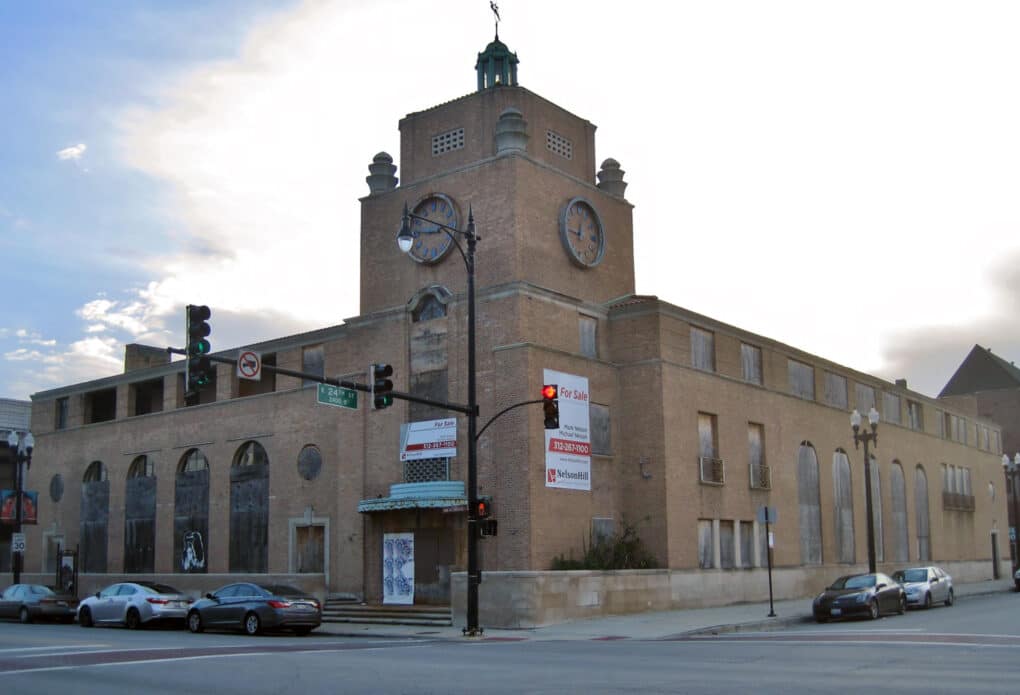 Large brick building with square clock tower.