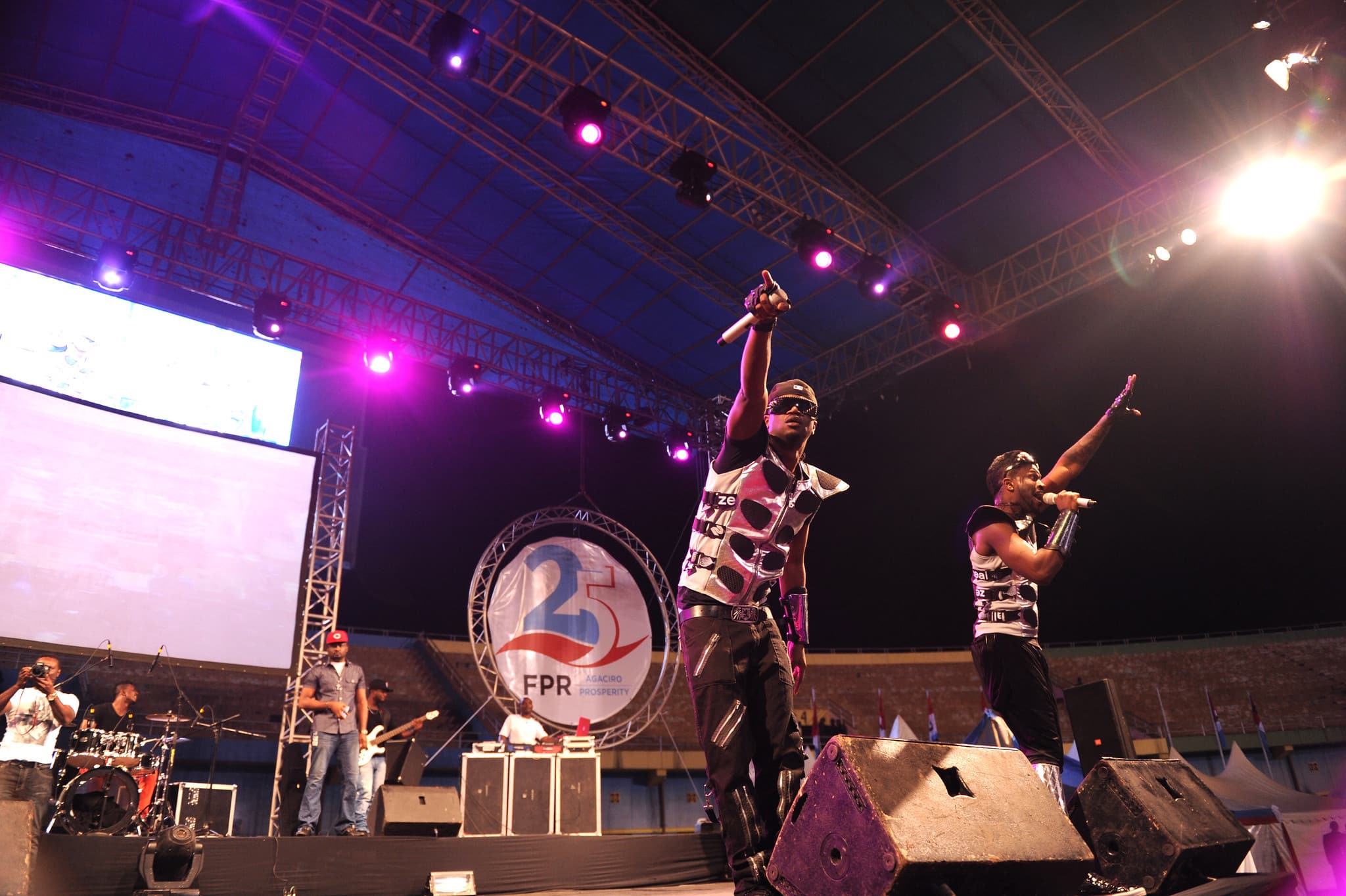 Click to Enlarge Rap duo performing onstage.