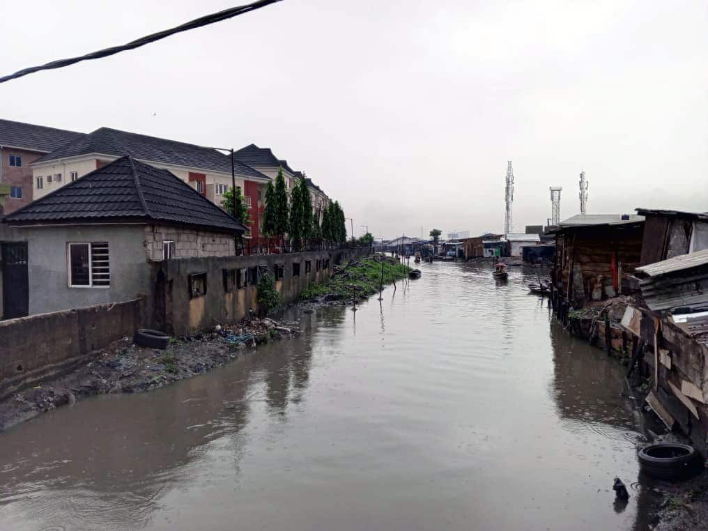 Click to Enlarge A channel of water, with houses on either side.