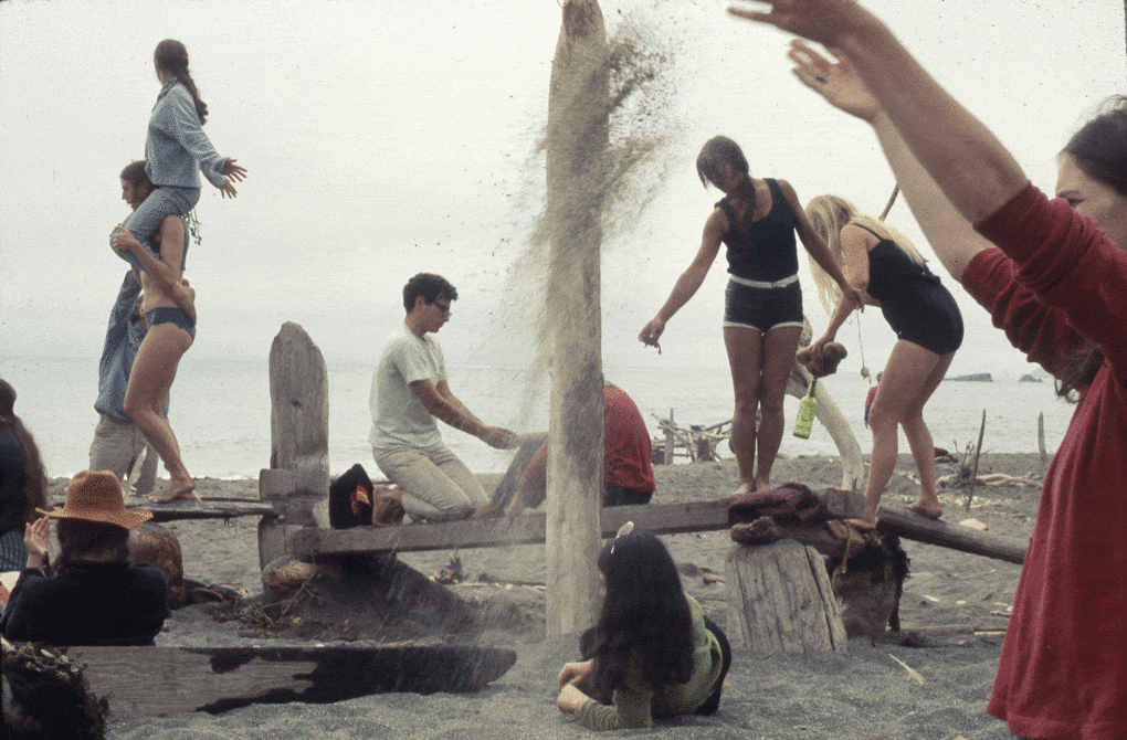 Photograph of Anna Halprin and Lawrence Halprin's Sea Ranch Driftwood Village Rebuilt event, one of their Experiments in Environment Workshops, 1966–71. 