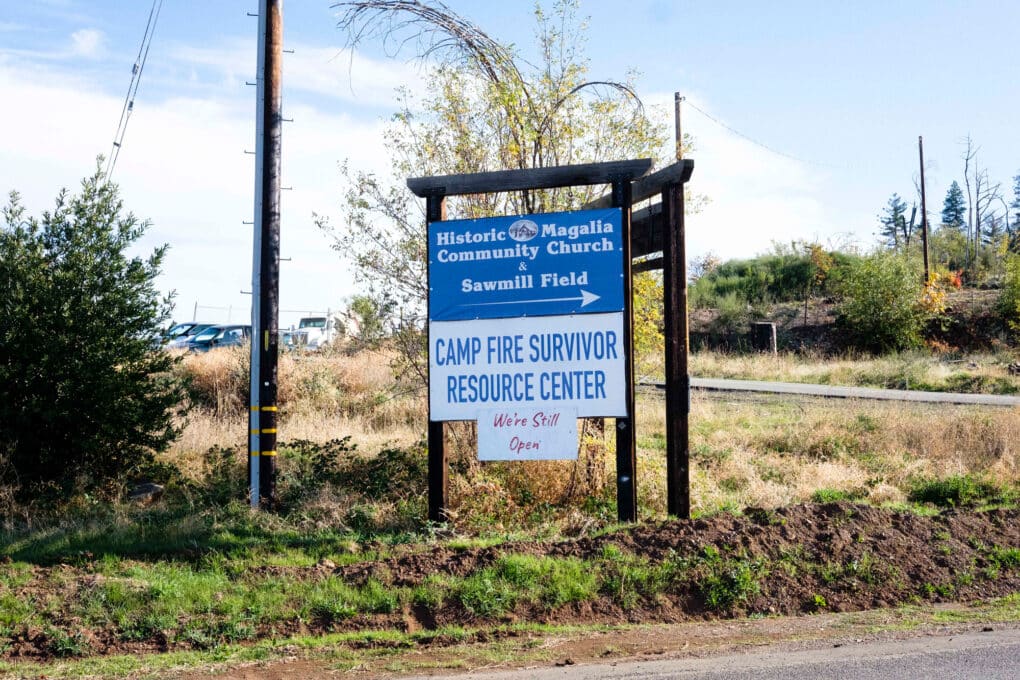 Color photograph of roadside sing for Camp Fire Survivor Resource Center.