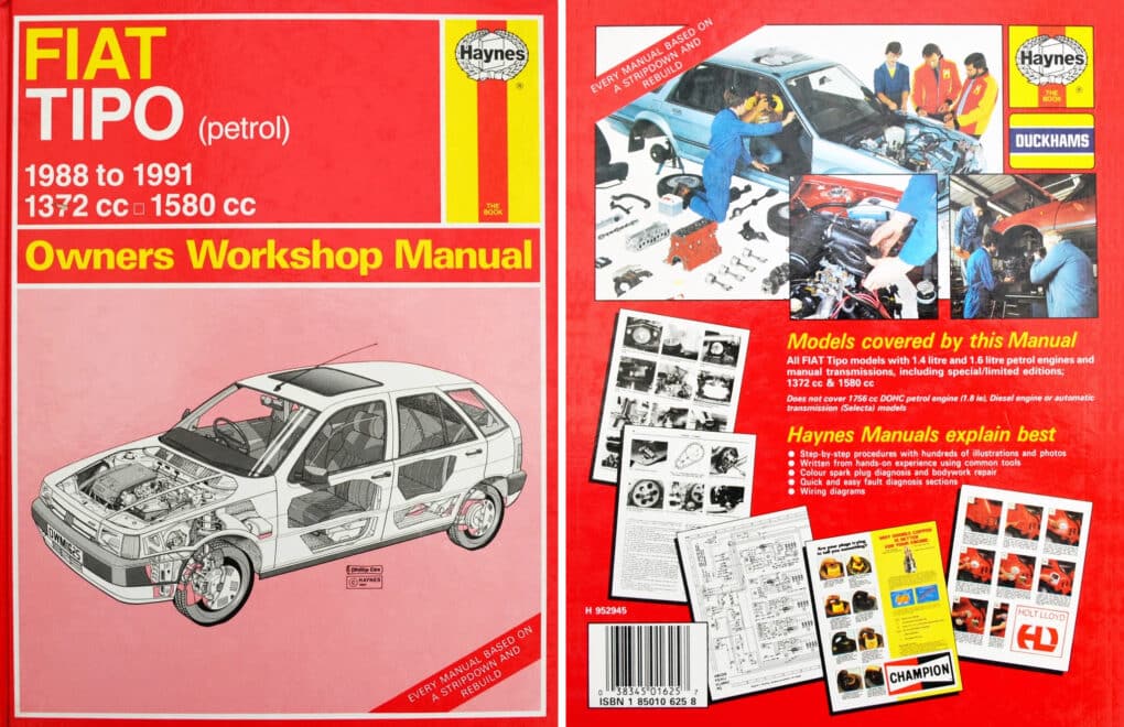 Front and back covers for a car repair manual. The front cover is notable for showing a cutaway diagram of the car's inner workings.