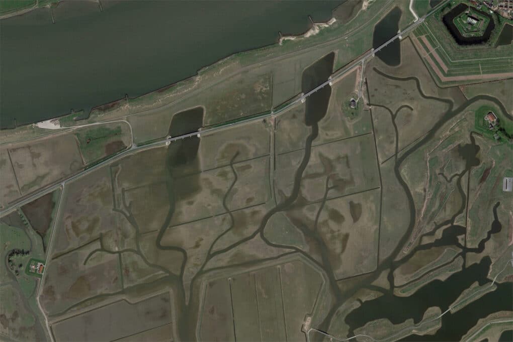 Satellite view of creek channels cutting through farmland, as part of the Depoldering Noordwaard project in the Netherland