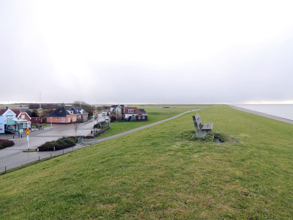 Bench on a dike facing the sea 
