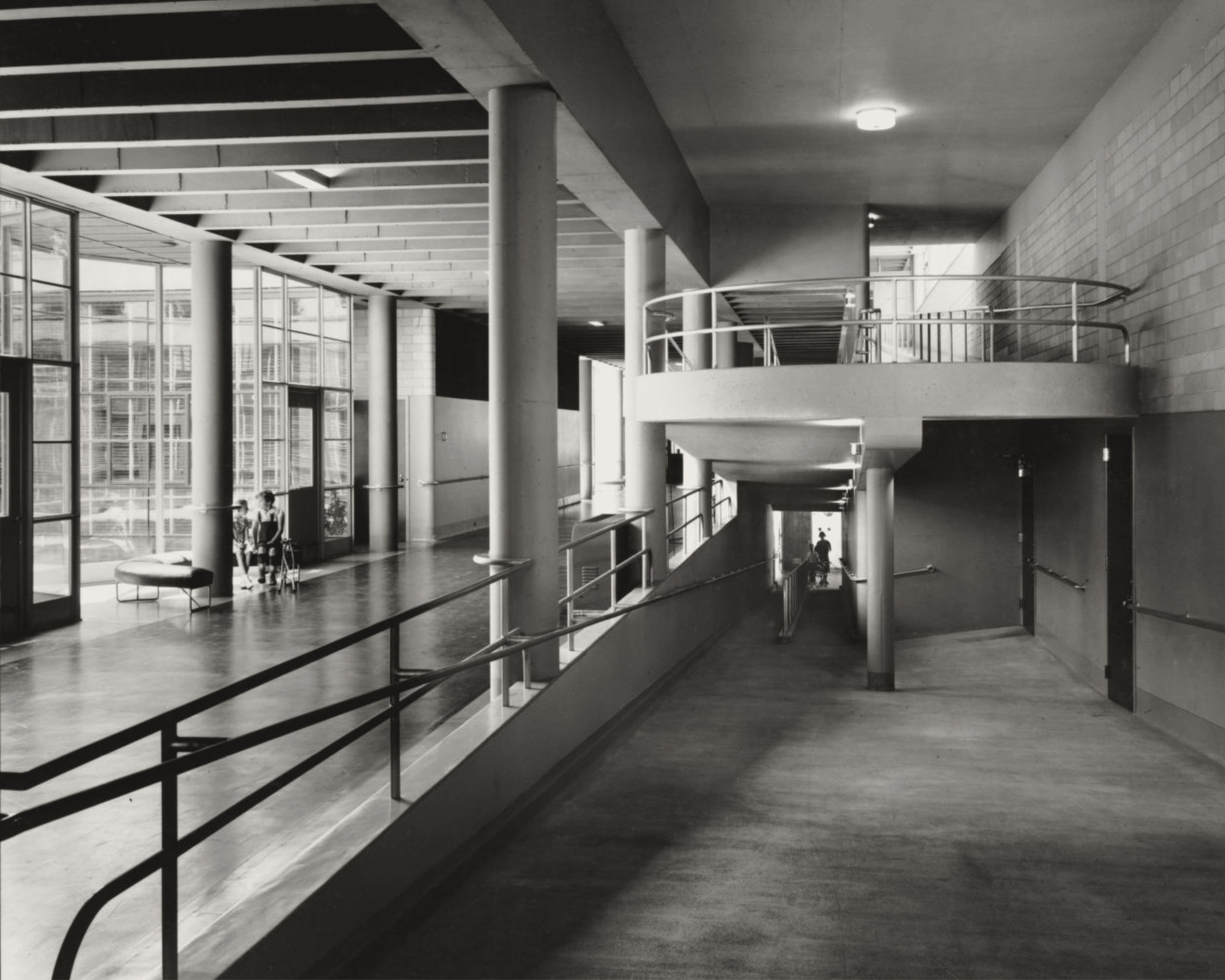 Click to Enlarge Direct view of curved ramp, looking upwards from first floor. Photographic documentation of architecture — no students are present.