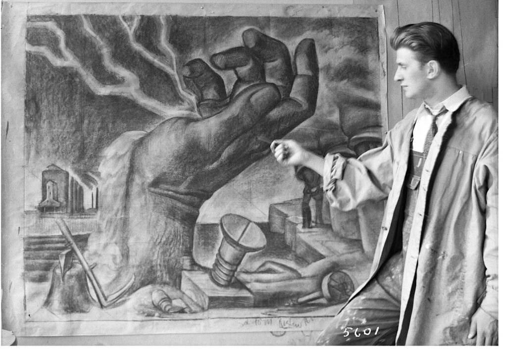A man wearing overalls and a paint-spattered smock is pointing to a drawing depicting a giant-size hand, cupped to receive a bolt of lightening. There are various symbols of industry in the foreground and background including a grain silo, screws and nails, and a scythe.