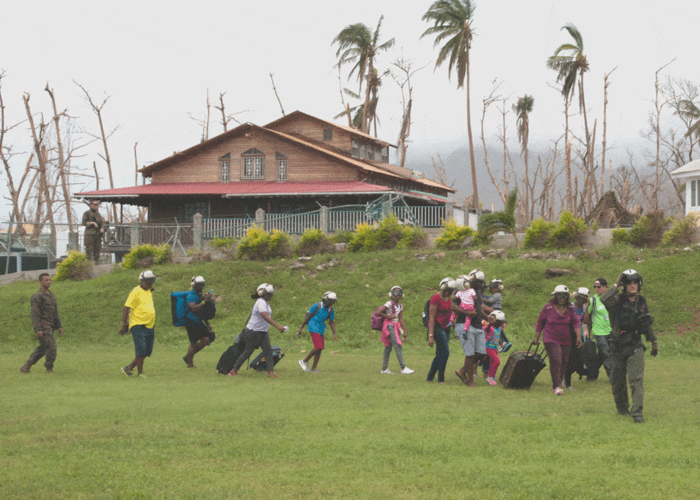 Dominica, Puerto Rico, U.S. Naval Airmen organize evacuation of residents after Hurricane Maria, September 15, 2017.