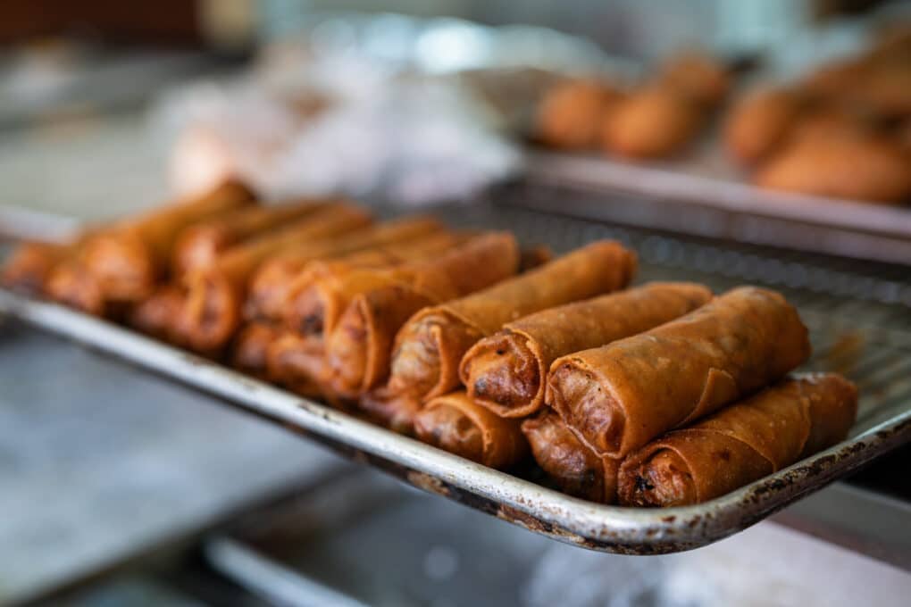 Sheet pan with fried egg rolls. 