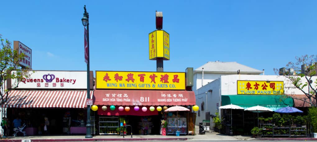 Color photo of four storefronts in LA's Chinatown on North Broadway, one block from Won Kok Restaurant.