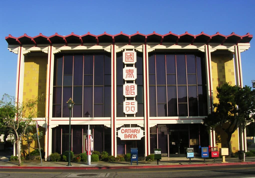 Front view of bank with Chinese-style red roof and signs in Chinese and English.
