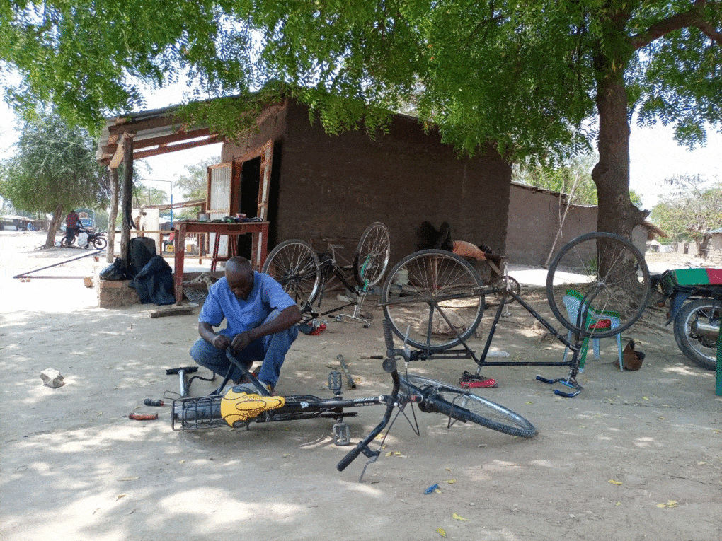 At the Rhino Camp Refugee Settlement, in Uganda, a volunteer repairs bicycles at the Bright Makerspace.