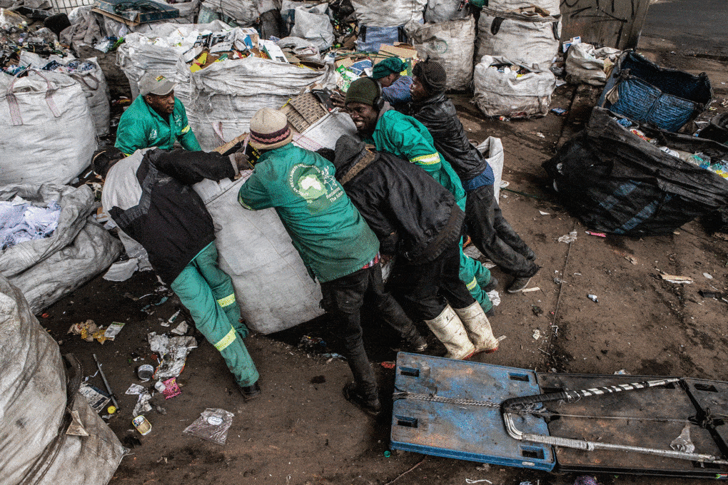 Reclaimers in Bekezela, an informal settlement in Johannesburg. Photograph by Mark Lewis. 