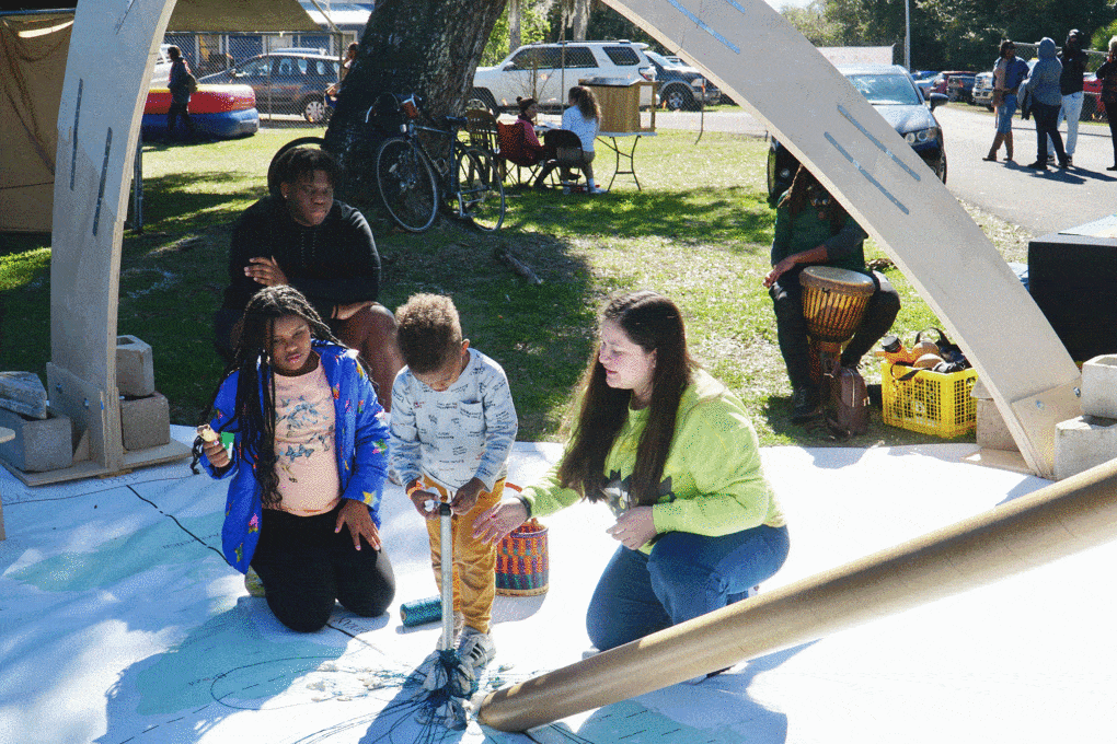 Using yarn and oyster shells, Apalachicola residents mark significant locations on a map that is part of the Meridian Dome project, 2023.