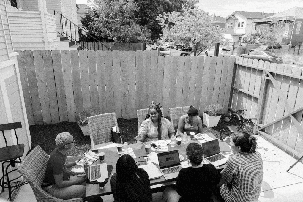 Moms4Housing and members of the Archive of Urban Futures research lab meet at Moms House in West Oakland. Photograph by Clara Perez. 