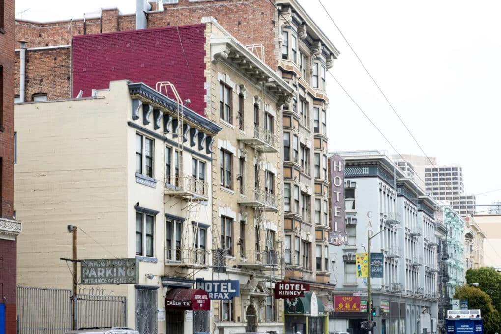 Street scene with five hotel signs visible. 