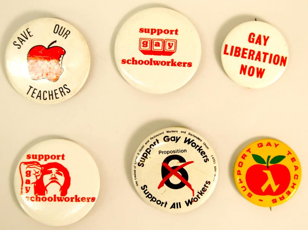 Six buttons with slogans such as "Save Our Teachers," and "Support Gay Schoolworkers."