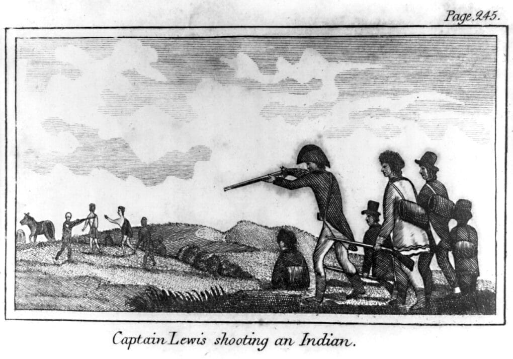 Black and white engraving of a man in a curved, military hat pointing his gun toward some people not far away. Beside him is Meriwether Lewis, recognizable in fur hat. 