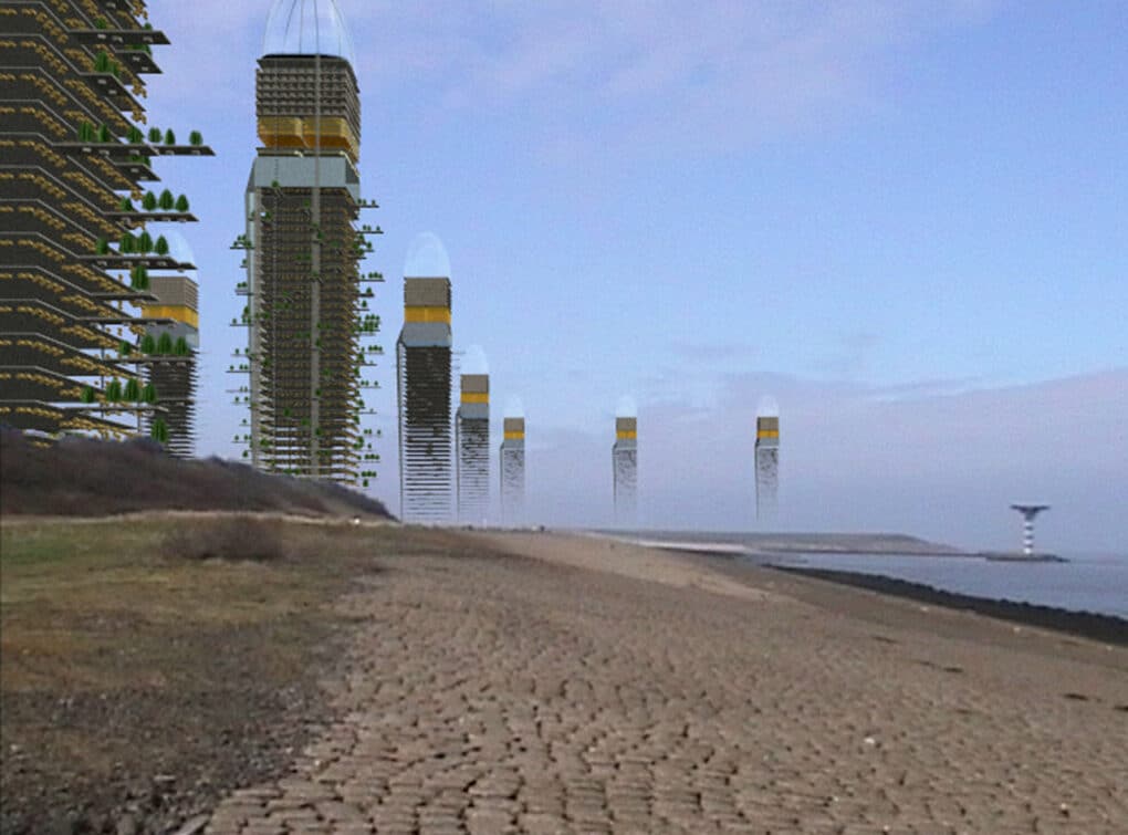 Color film still showing imaginary skyscraper towers with long balconies, some with trees on them, set against a blue sky on a dry, sandy shore.