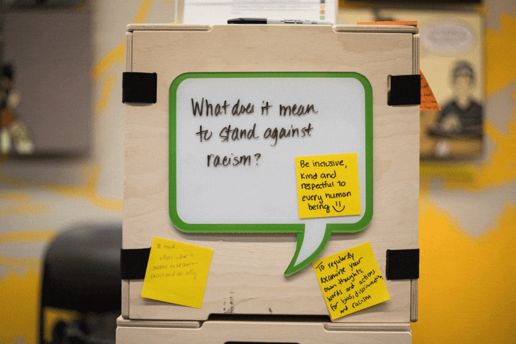 A sign at the Civic Lab at the Skokie Public Library, saying "What does it mean to stand against racism"?