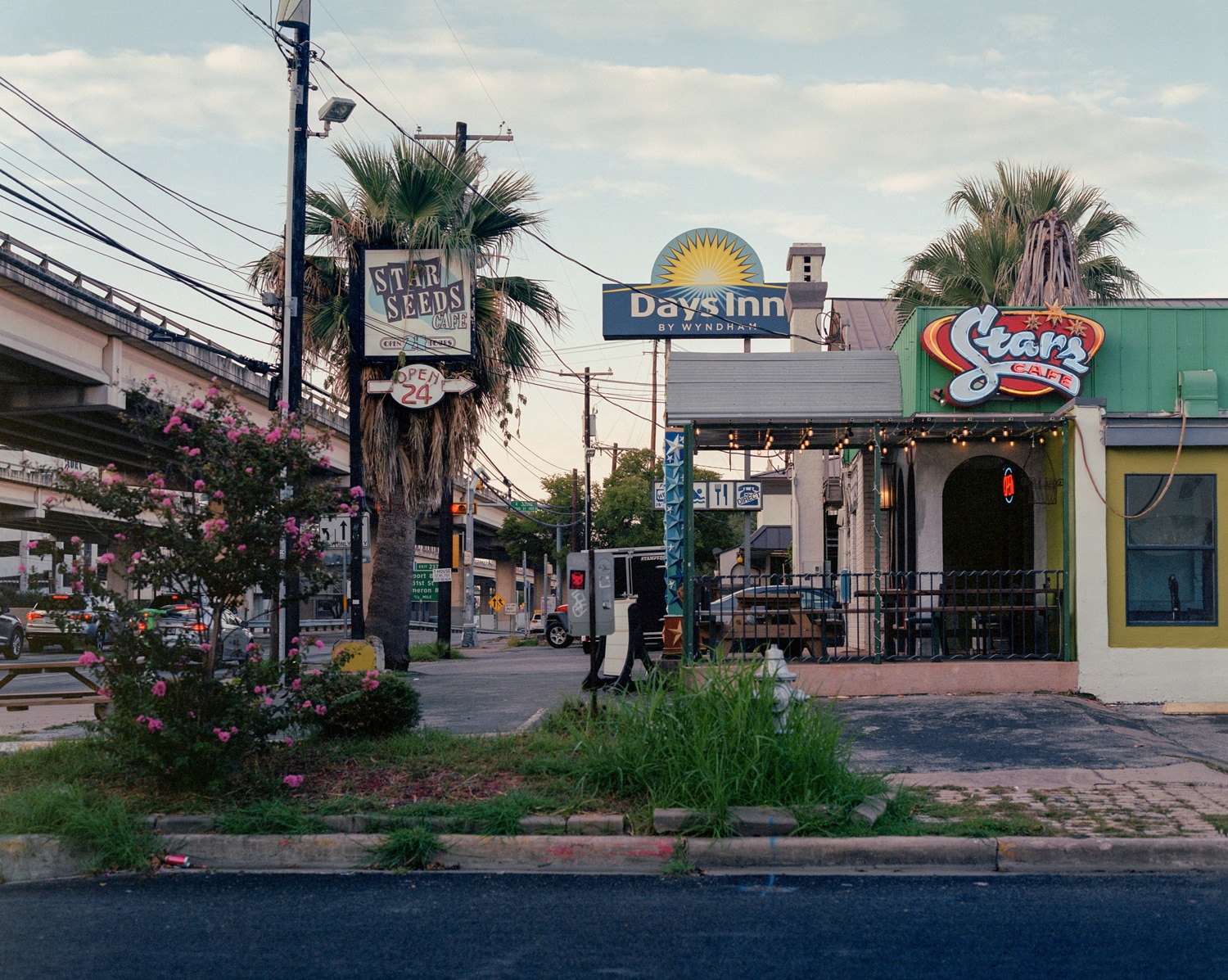 Click to Enlarge Color photograph of businesses beside highway (Stars Cafe, Days Inn, etc.)