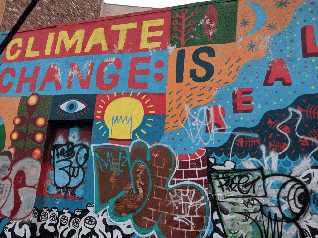 Photo of street mural in Brooklyn, New York, ca. 2019, with the words "Climate Change Is Real."