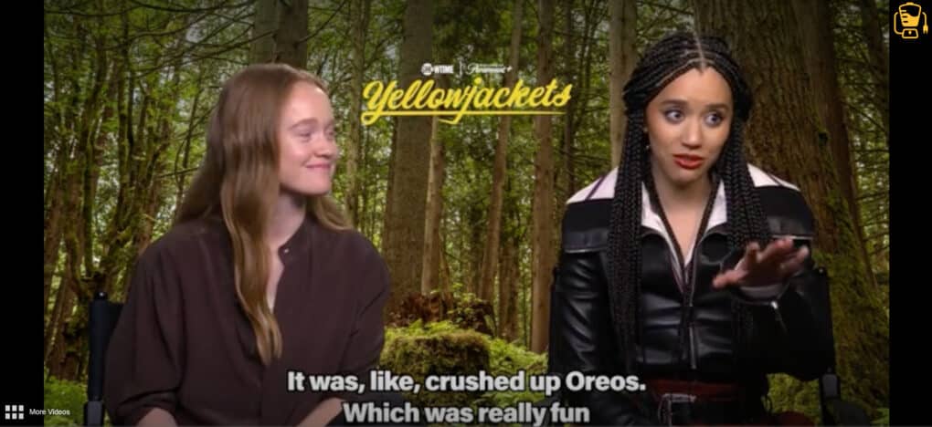 Screenshot of two teenage actresses in front of a woodland scene backdrop. The caption reads: "It was, like, crushed up Oreos. Which was really fun."