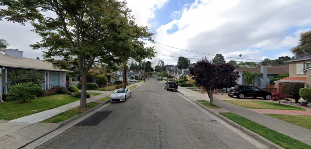 Color photograph of modest California street on cloudy day.