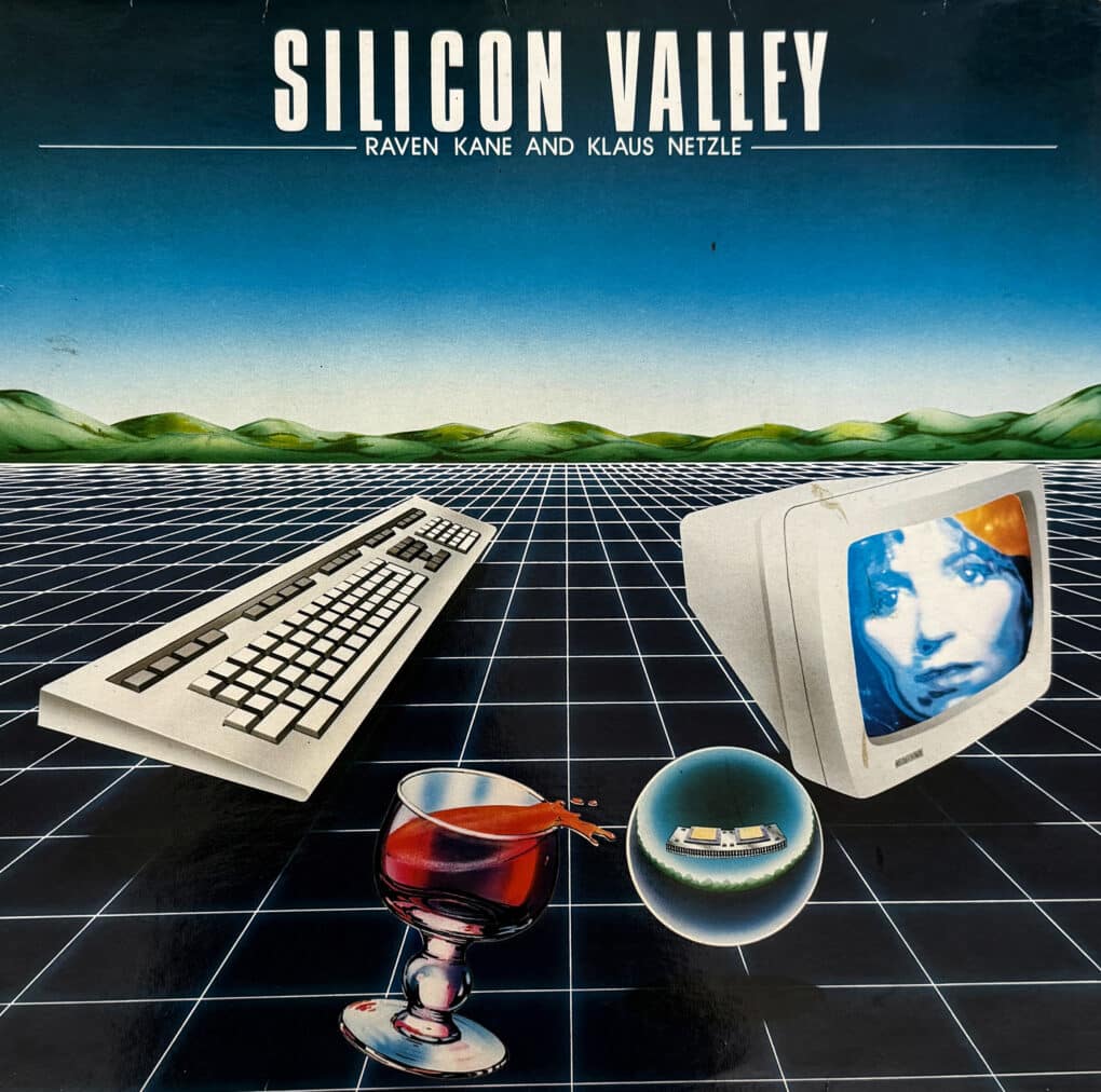 Record album shows a grid extending to horizon with a old-school computer monitor, keyboard, and goblet of wine floating on the grid.