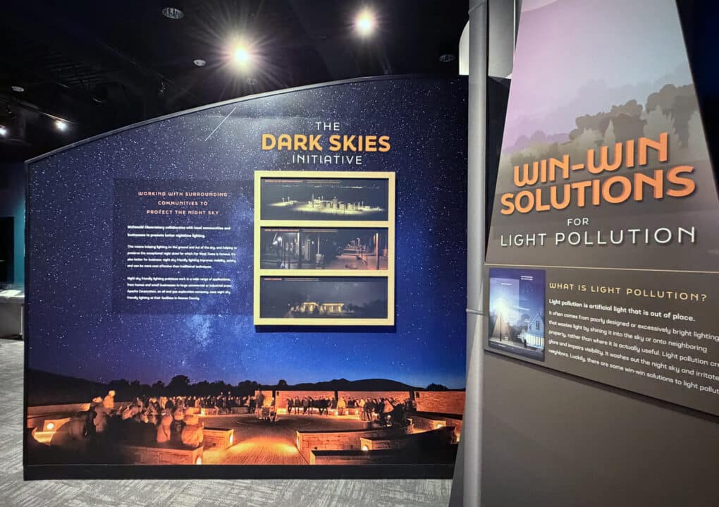 Entrance to a museum exhibition, reading "The Dark Skies Initiative" and "Win-Win Solutions for Light Pollution."